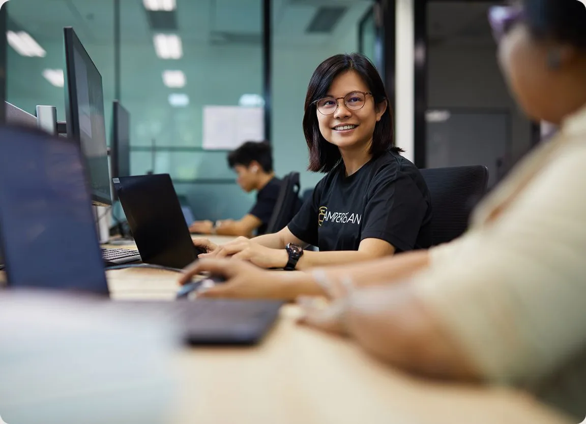 Amperesand team collaborating across offices